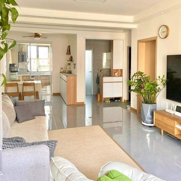 A bright, modern living room interior of a spacious flat. Discover affordable and premium residential apartments for sale in Ghaziabad and Noida with the top Real Estate Services in Delhi NCR.